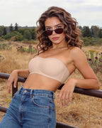 PLERIVA Anti-Slip Strapless Wireless Lift Bra in Nude, worn outdoors with jeans