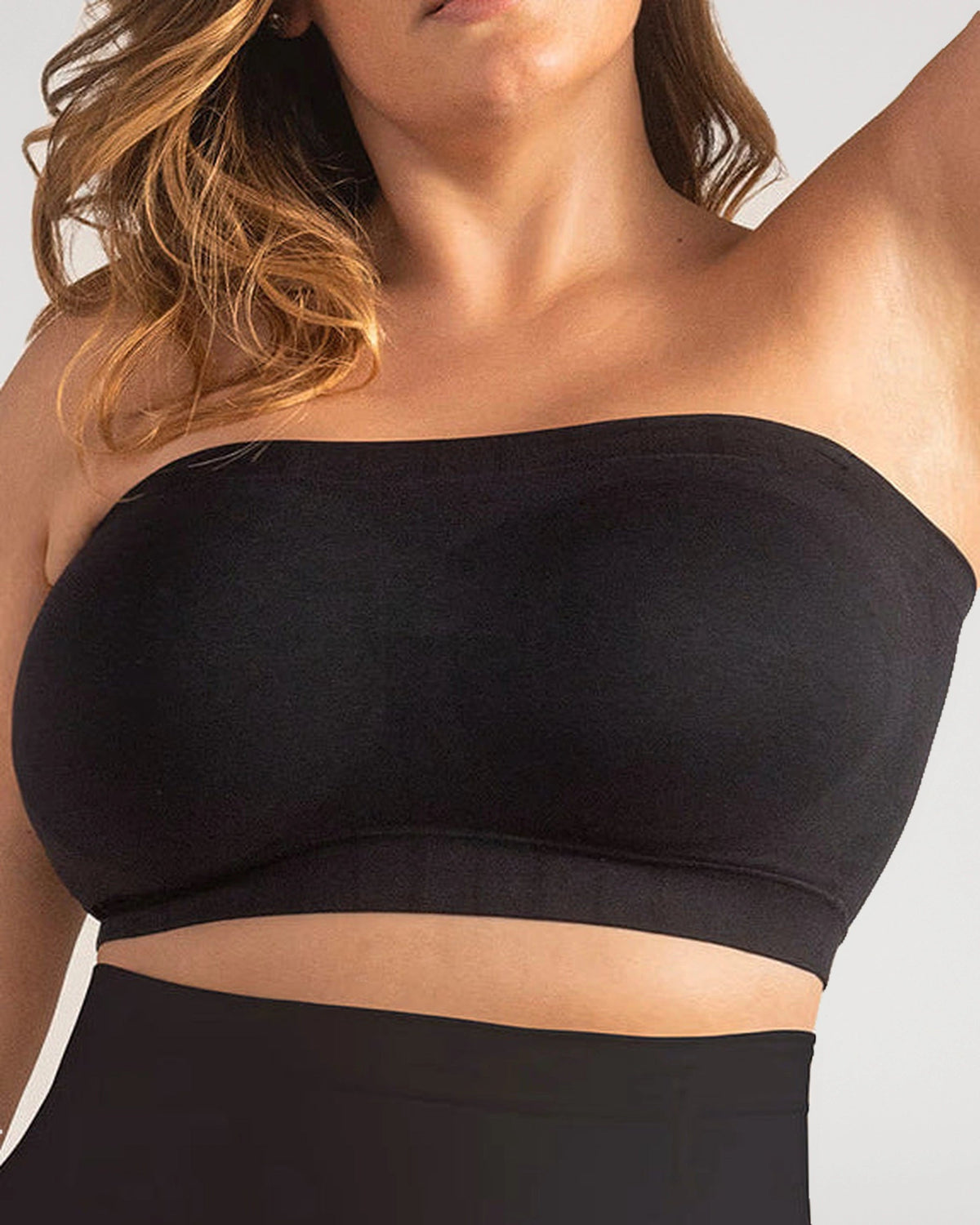 PLERIVA Convertible Invisible Support Bra in Black, strapless close-up on a fuller bust