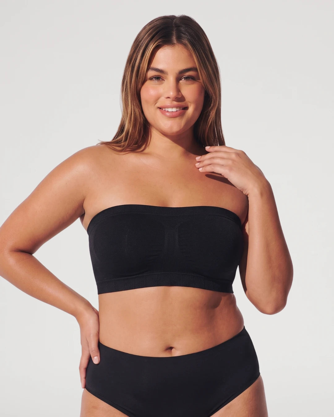 PLERIVA Convertible Invisible Support Bra in Black, strapless front view on model with matching briefs