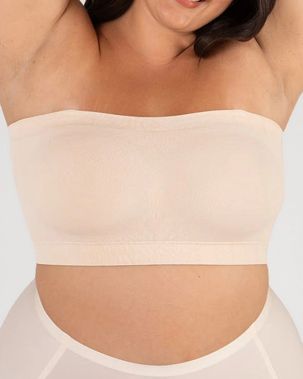 PLERIVA Convertible Invisible Support Bra in Skin, strapless front view with arms raised
