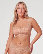 PLERIVA Deep V Lace Racerback Bralette in Light Leopard, front view with matching brief, hand on hip