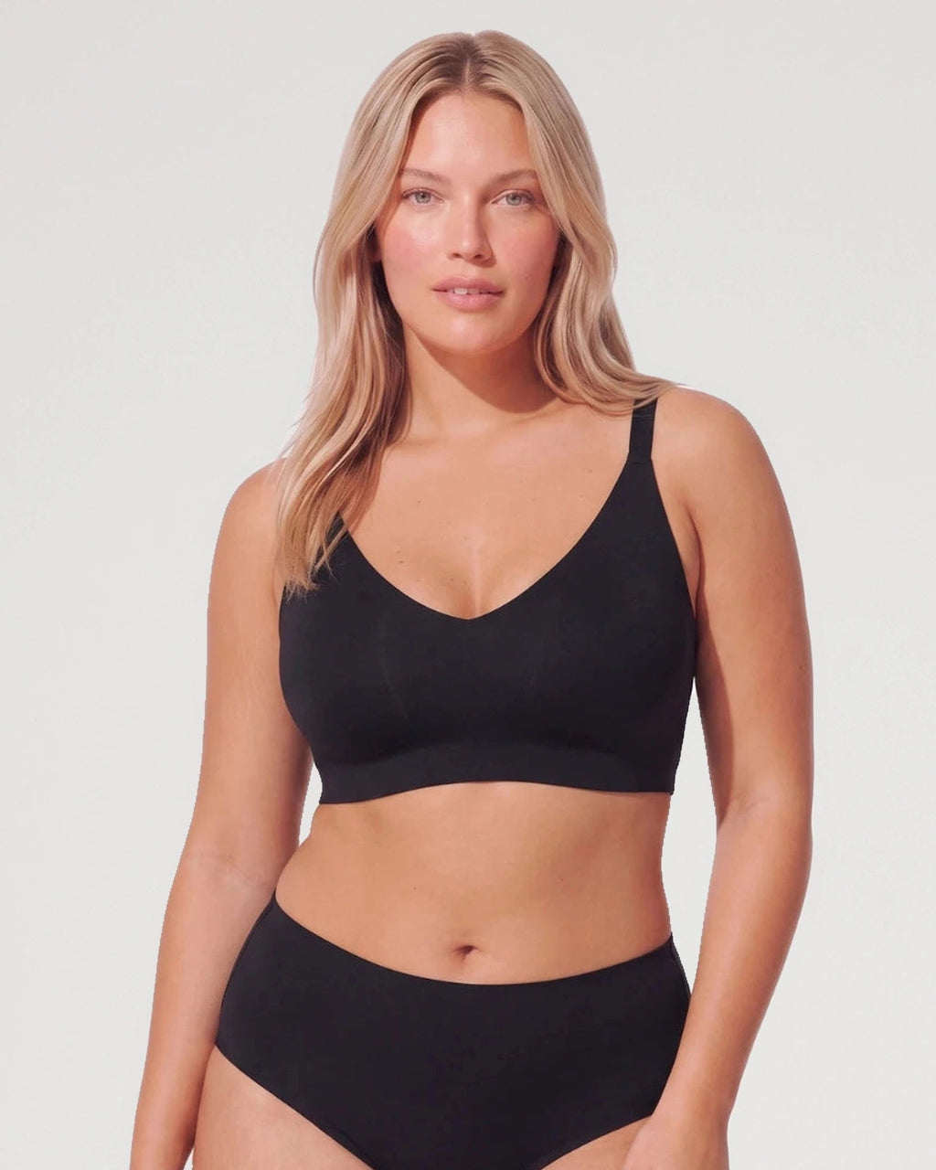 PLERIVA Deep V Wireless Bralette with Lace Back in Black, front view on model
