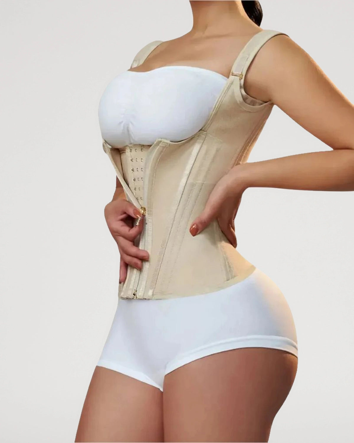 PLERIVA Double Waistband Corset Shaping Vest in Nude, side view while fastening the hooks