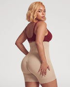 PLERIVA High Waist Tummy Control Sculpting Shorts in Nude, back three-quarter view on model