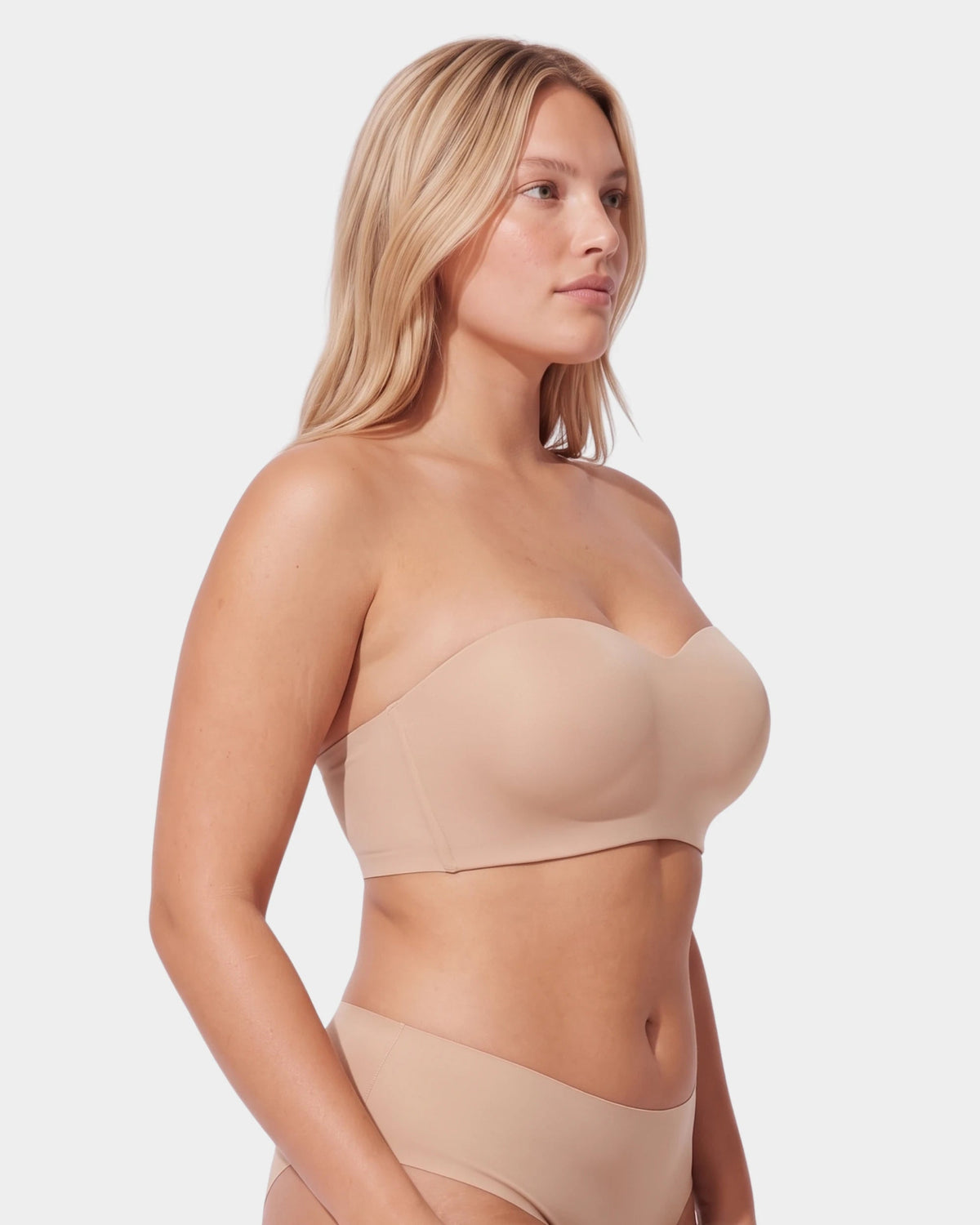 PLERIVA Molded Strapless Underwire Bandeau in Nude, three-quarter view on model