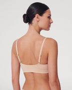 PLERIVA Padded Wireless Plunge Bralette in Nude, back view showing the adjustable straps