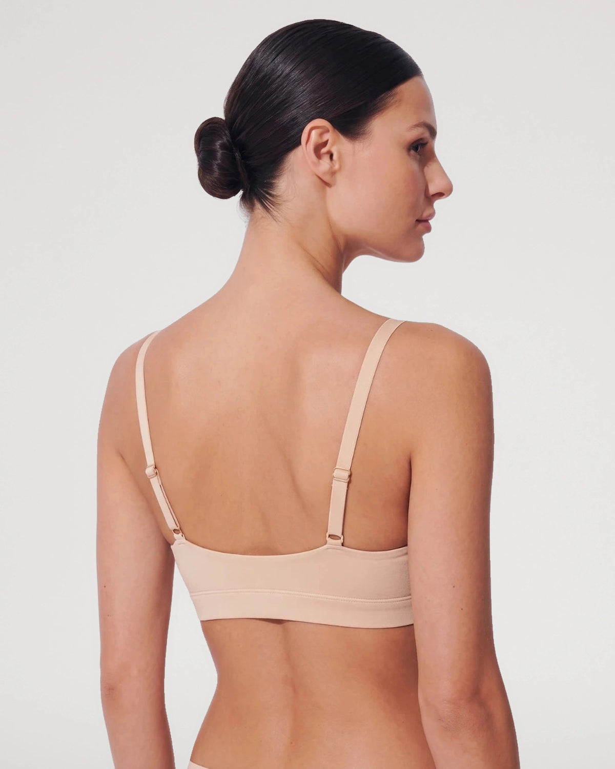 PLERIVA Padded Wireless Plunge Bralette in Nude, back view showing the adjustable straps