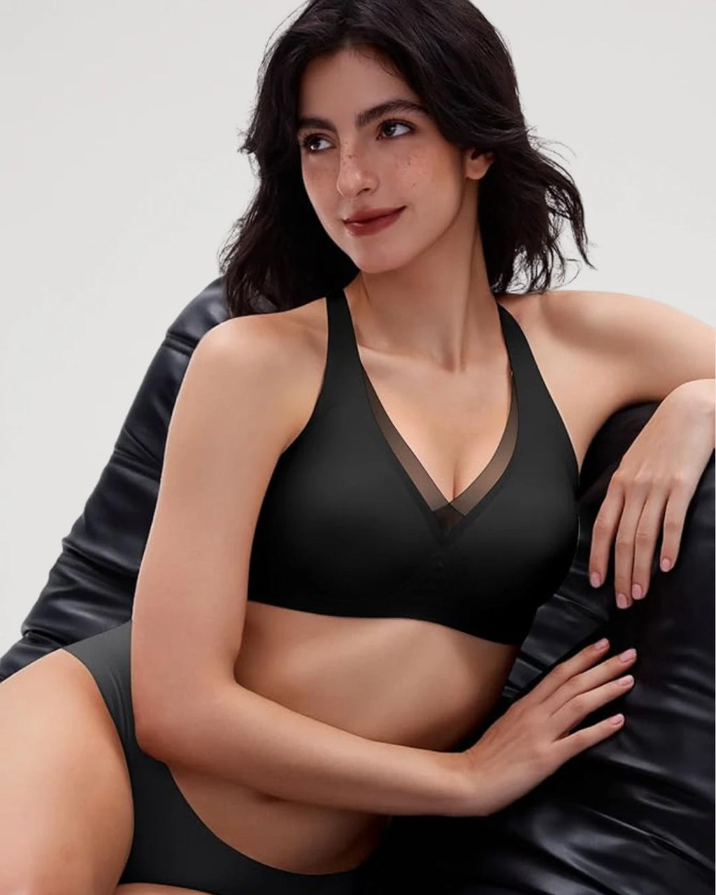 PLERIVA Seamless Mesh Wireless Plunge Lift Bra in Black, seated lifestyle shot
