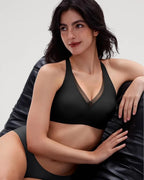 PLERIVA Seamless Mesh Wireless Plunge Lift Bra in Black, seated lifestyle shot