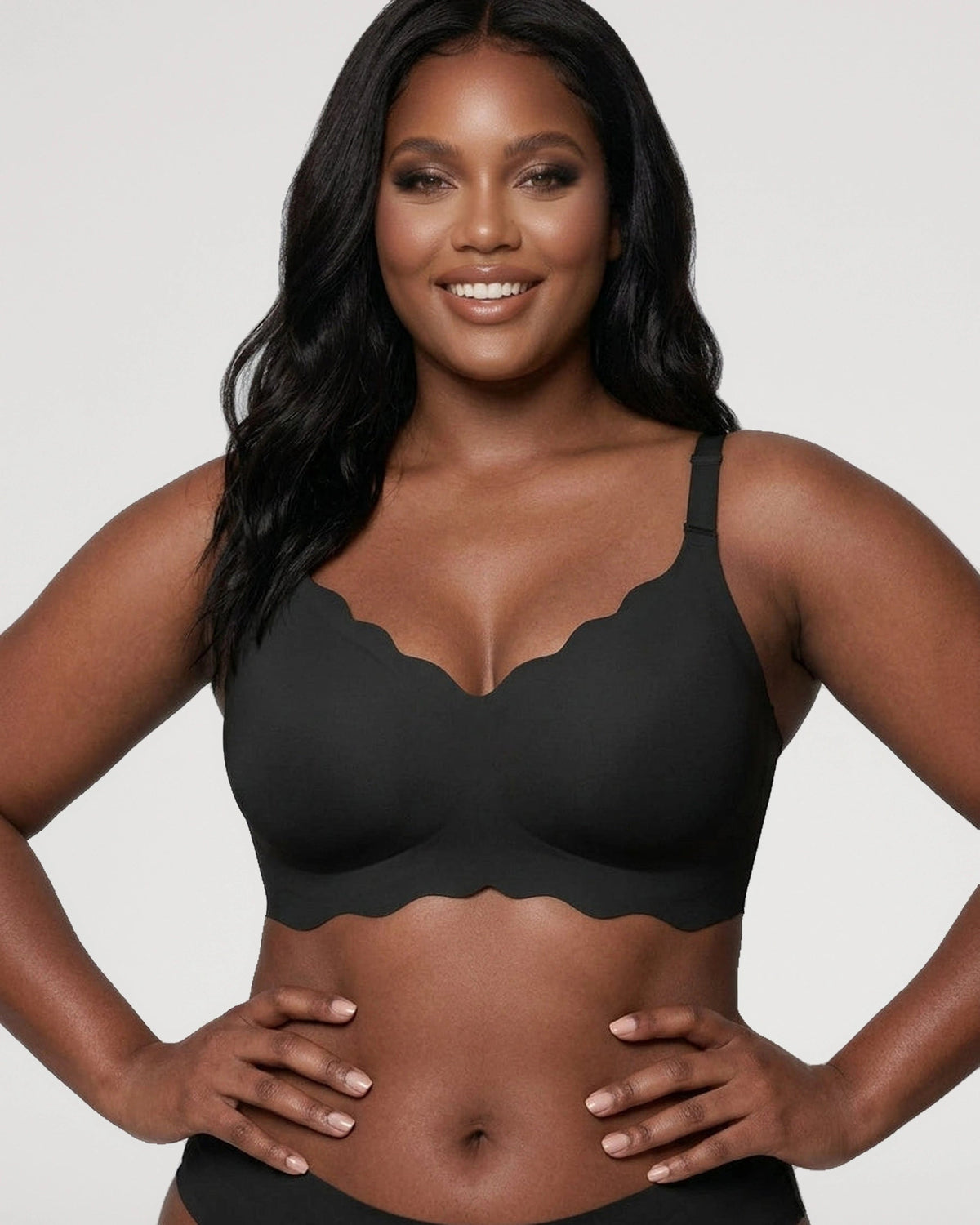PLERIVA Seamless Scalloped Wireless Bra in Black, front view on model