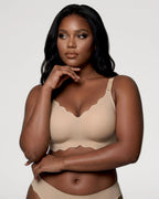 PLERIVA Seamless Scalloped Wireless Bra in Nude, three-quarter view on model