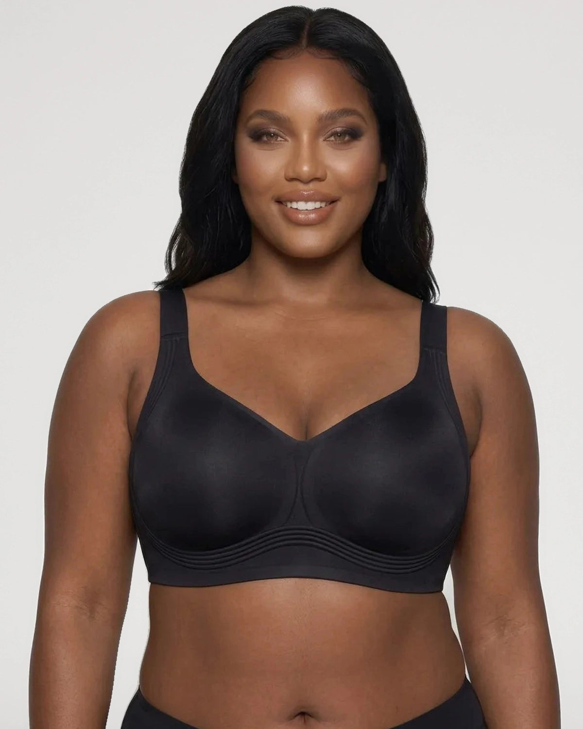 PLERIVA Seamless Wireless Full Coverage Lift Bra in Black, front view on a smiling model