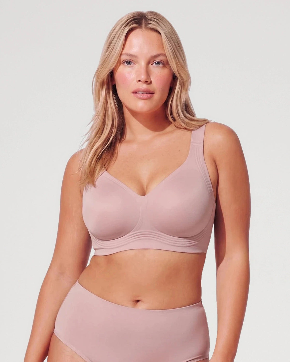 PLERIVA Seamless Wireless Full Coverage Lift Bra in Nude Pink, front view on model