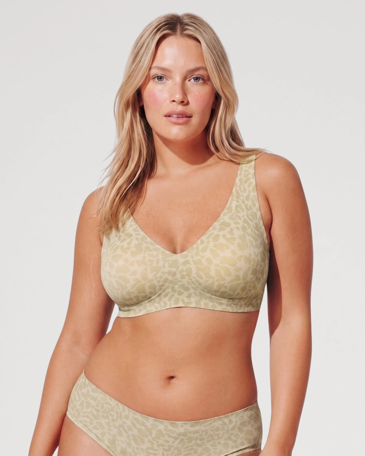 PLERIVA Seamless Wireless Plunge Lift Bra in Green Leopard, front view on model with matching brief