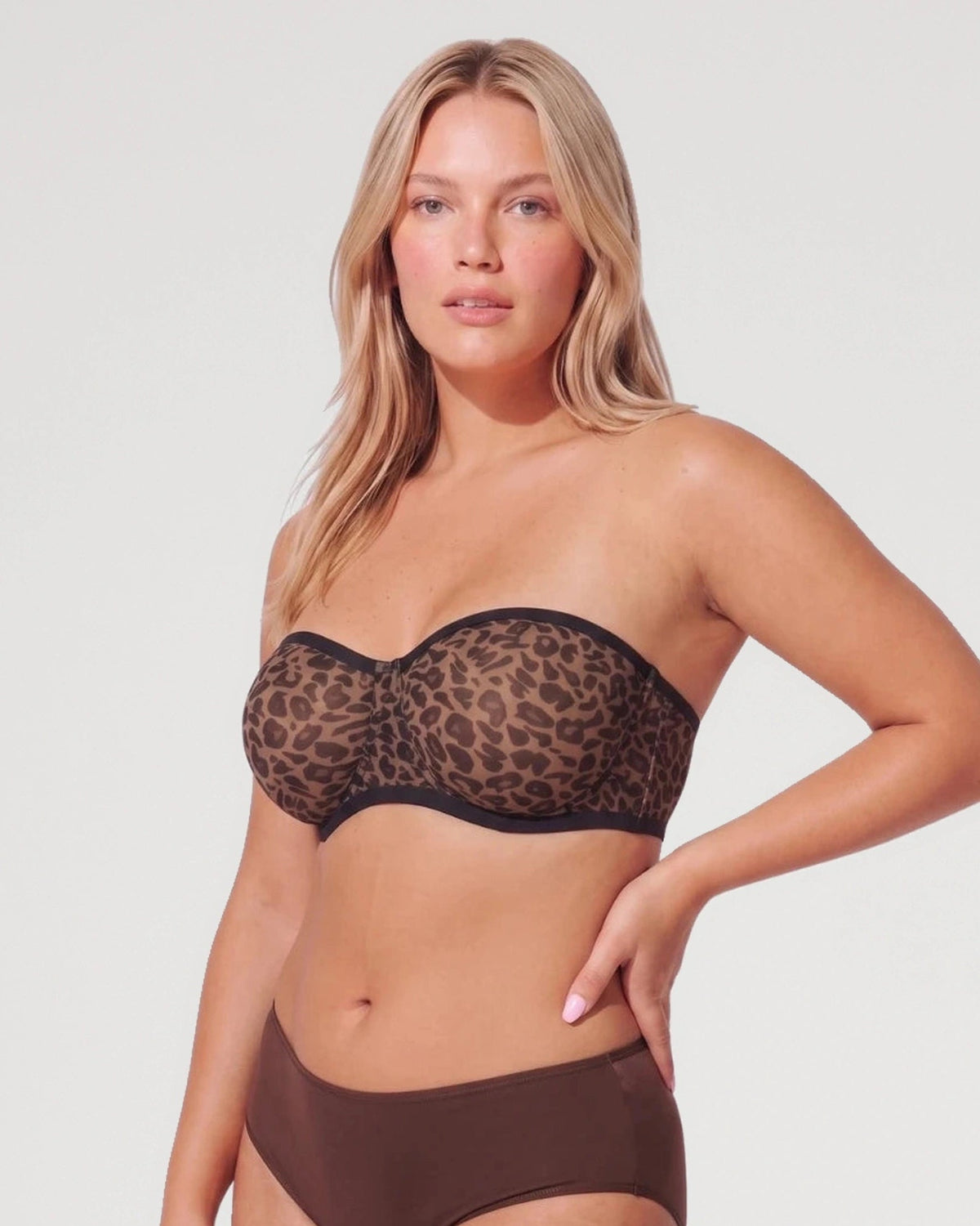 PLERIVA Sheer Mesh Strapless Underwire Balconette in Leopard, front view with hand on hip