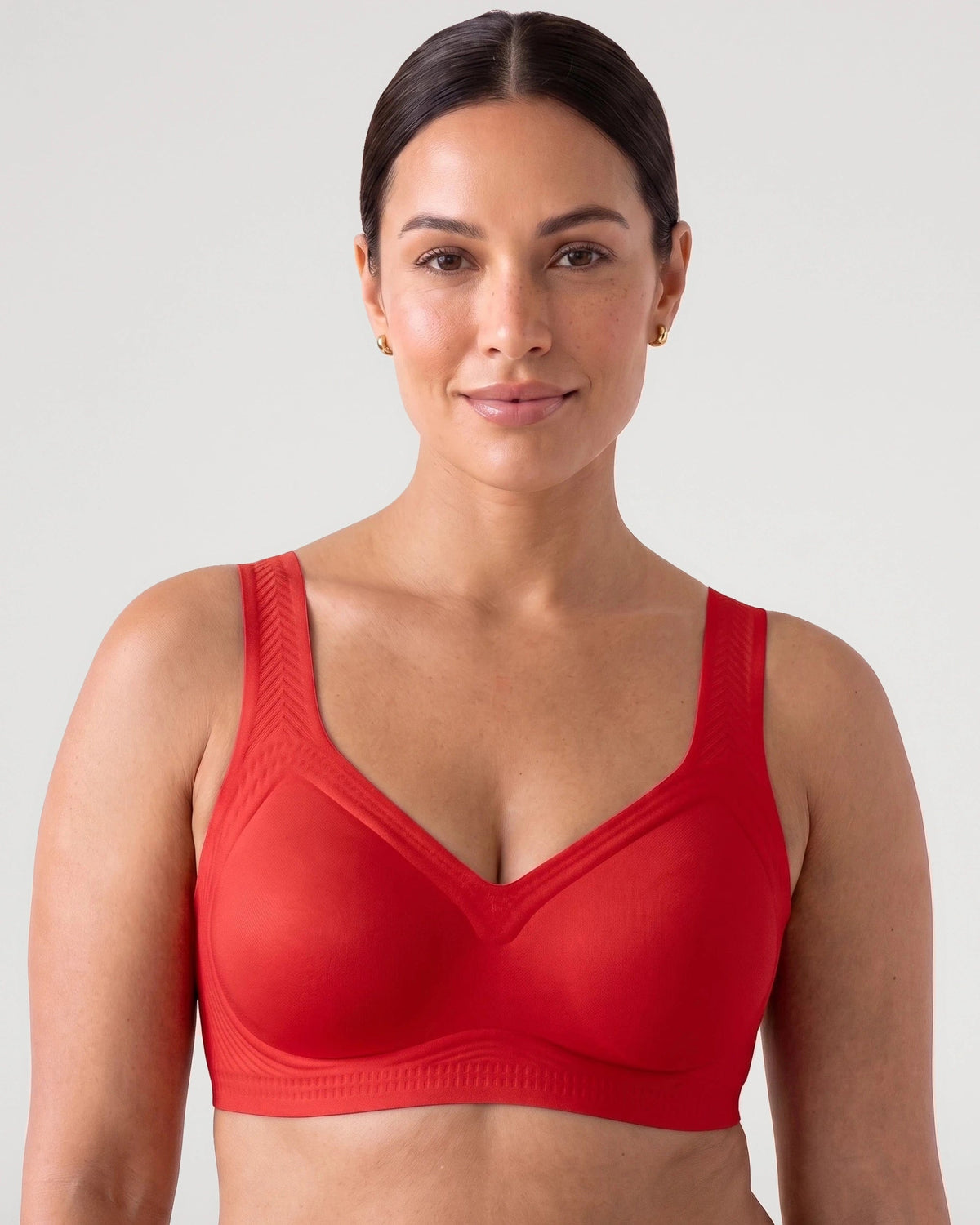PLERIVA Smooth Back Full Coverage Wireless Bra in Red, front view on model