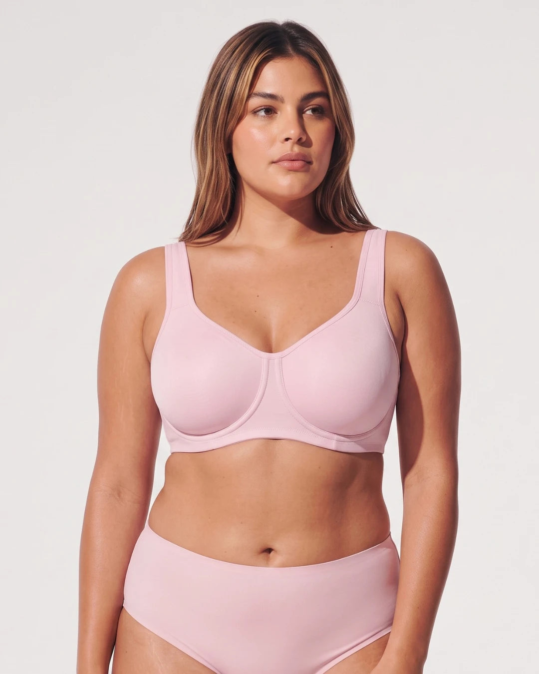 PLERIVA Unlined Full Coverage Underwire Bra in Pink, front view on model with matching brief
