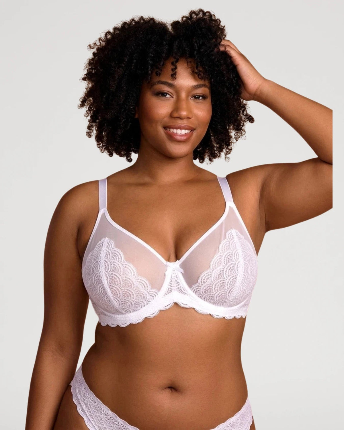 PLERIVA Unlined Lace Underwire Minimizer Bra in White, front view on model with hand in hair