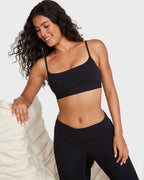 PLERIVA Unlined Scoop Neck Wireless Bralette in Black, lifestyle shot on model