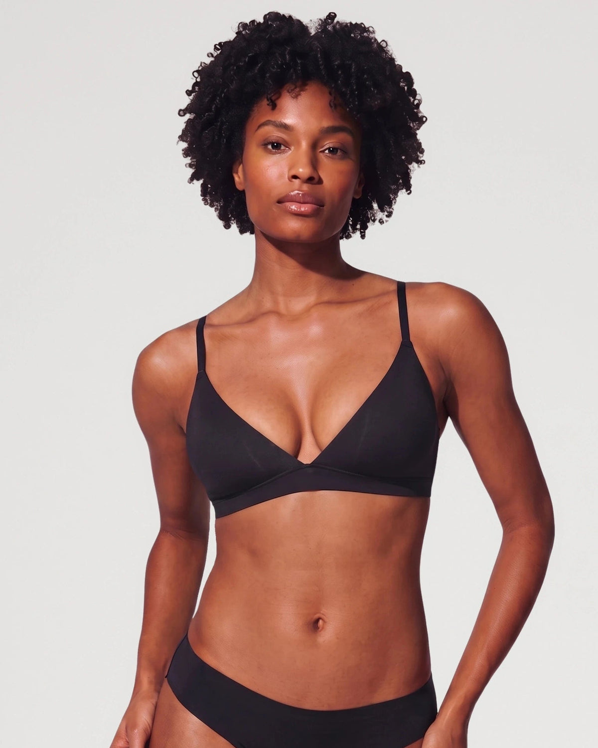 PLERIVA Unlined Wireless Plunge Bralette in Black, front view on model