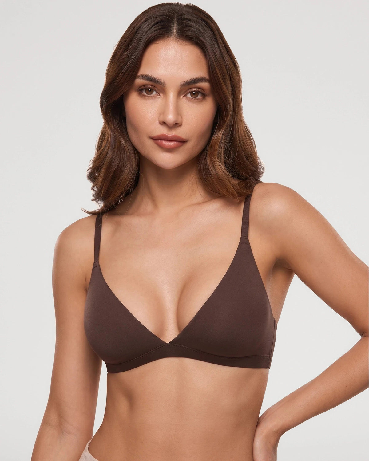 PLERIVA Unlined Wireless Plunge Bralette in Hazelnut, front view on model with hand on hip