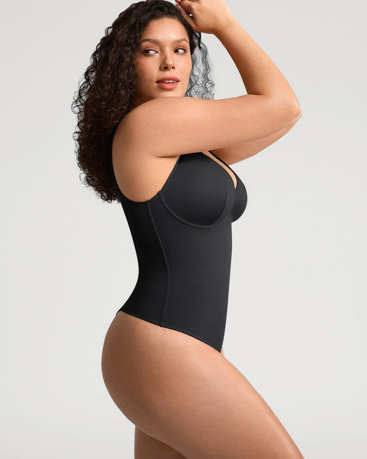 PLERIVA V-Neck Tummy Control Sculpting Bodysuit in Black, side view on model