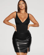 PLERIVA V-Neck Tummy Control Sculpting Bodysuit in Black, styled with a leather skirt