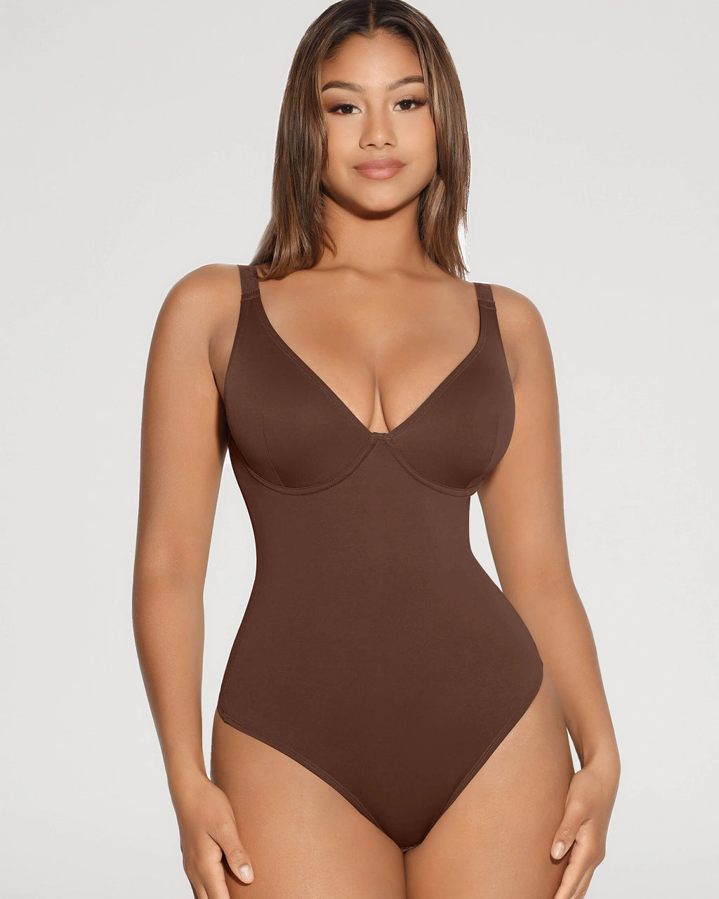PLERIVA V-Neck Tummy Control Sculpting Bodysuit in Brown, standing front view on model