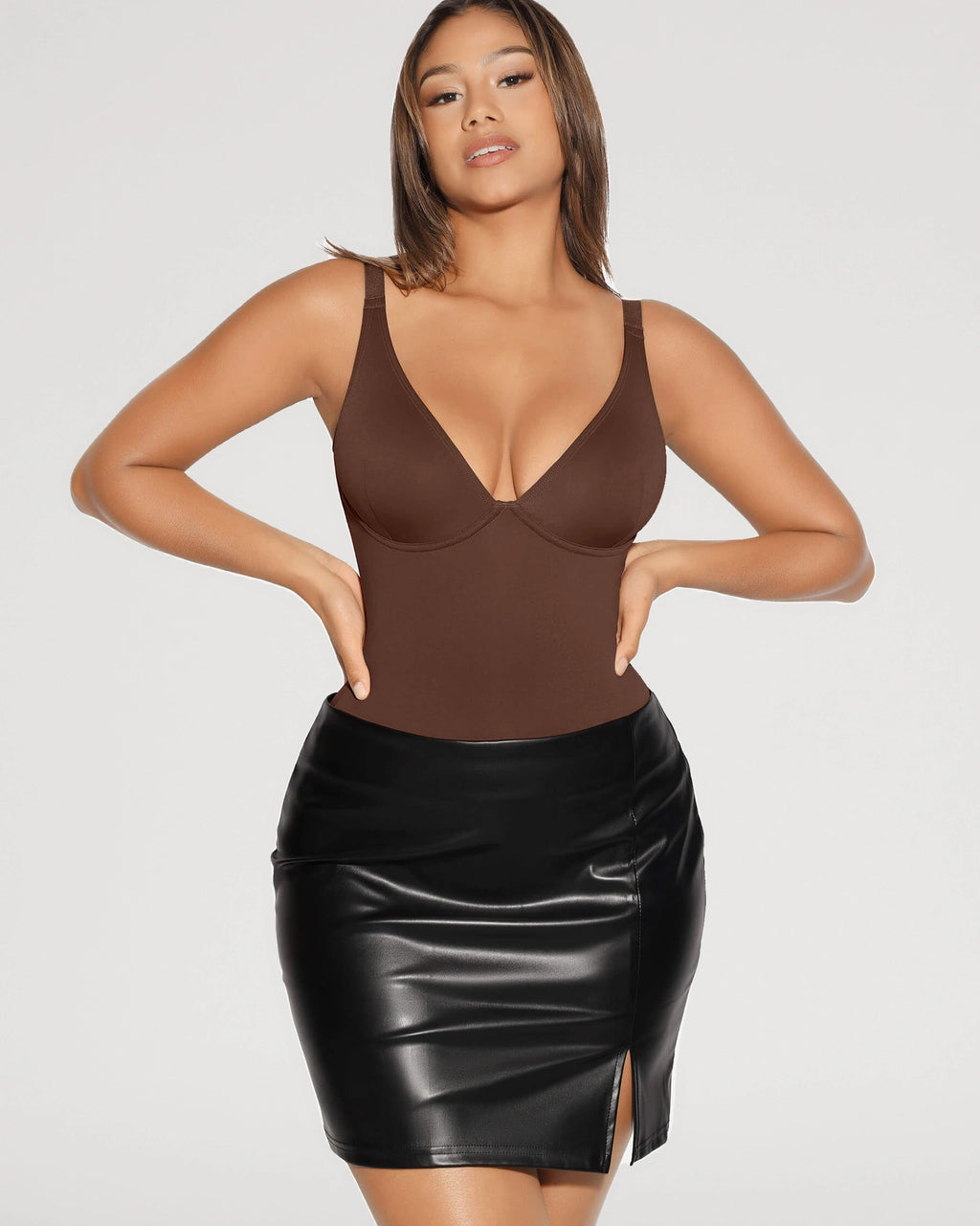 PLERIVA V-Neck Tummy Control Sculpting Bodysuit in Brown, styled with a leather skirt