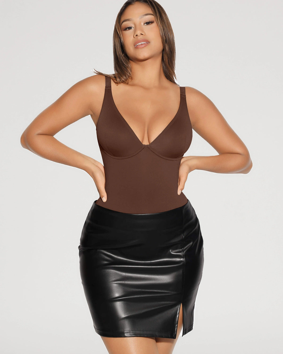 PLERIVA V-Neck Tummy Control Sculpting Bodysuit in Brown, styled with a leather skirt
