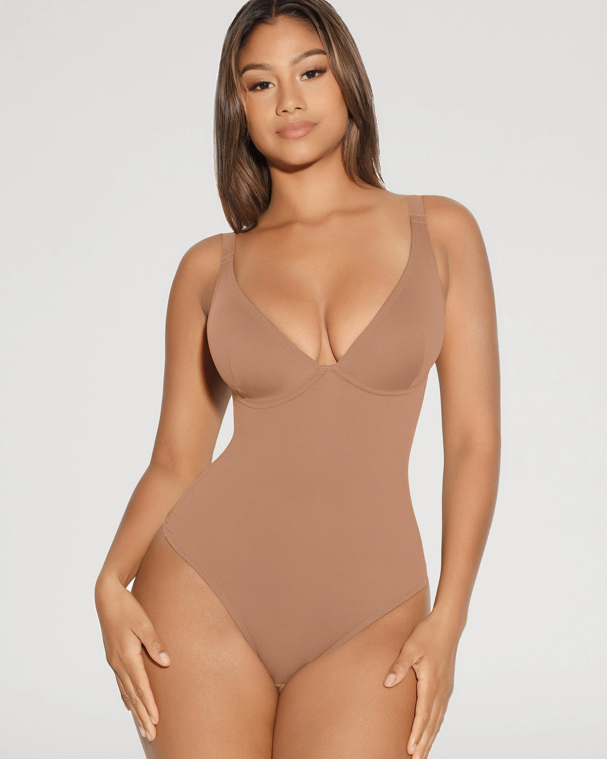 PLERIVA V-Neck Tummy Control Sculpting Bodysuit, front view on model in a tan shade