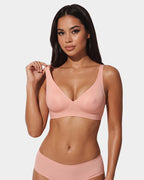 PLERIVA Wireless Contour Detail Lift Bra in Pink, front view adjusting the strap