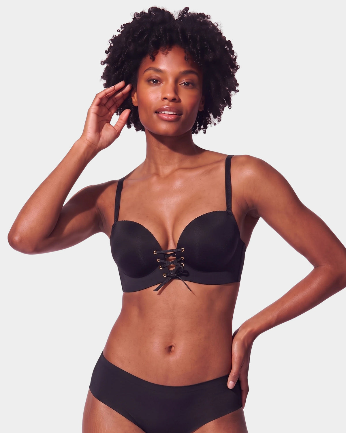 PLERIVA Wireless Lift Bra with Lace-Up Front in Black, front view on model showing the lace-up front