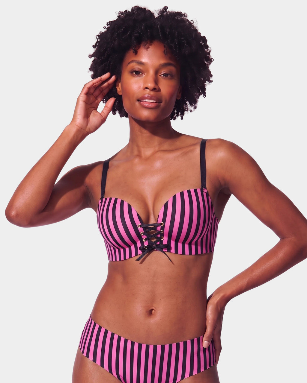 PLERIVA Wireless Lift Bra with Lace-Up Front in Magenta Black Stripe, front view on model showing the lace-up front