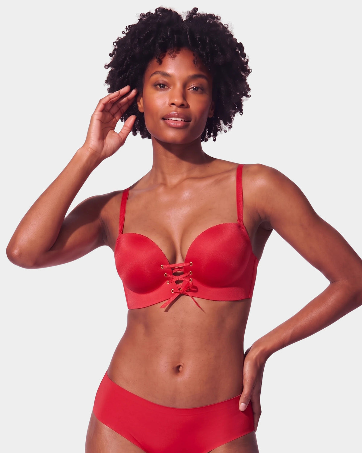 PLERIVA Wireless Lift Bra with Lace-Up Front in Red, front view on model showing the lace-up front