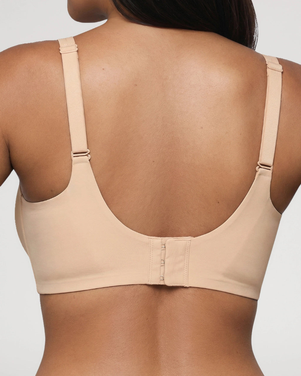 PLERIVA Wireless Plunge Lift Bra in Nude, back view showing the hook-and-eye closure