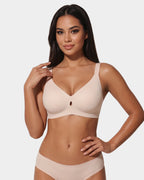 PLERIVA Wireless Plunge Lift Bra in Nude, front view on model with matching briefs