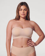 PLERIVA Wireless Seamless Strapless Bandeau in Nude, front view on a curvy model